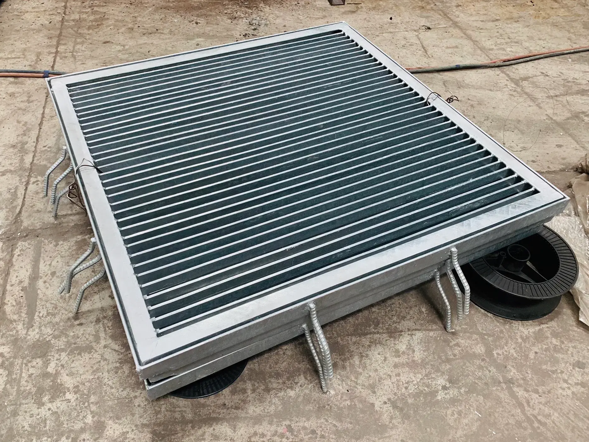 Framed steel drain grating panels